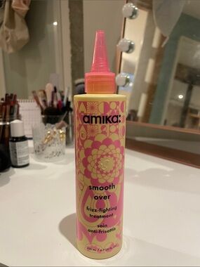 amika Smooth Over Frizz-Fighting Treatment — Pink & Yellow Bottle